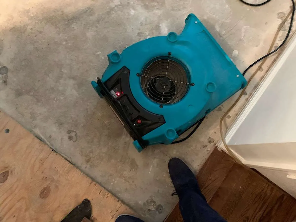 Air mover drying subfloor during Leak Detection & Repair in Ballston